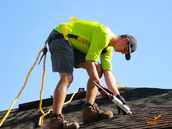 Norcal-Roofing's worker on a roof